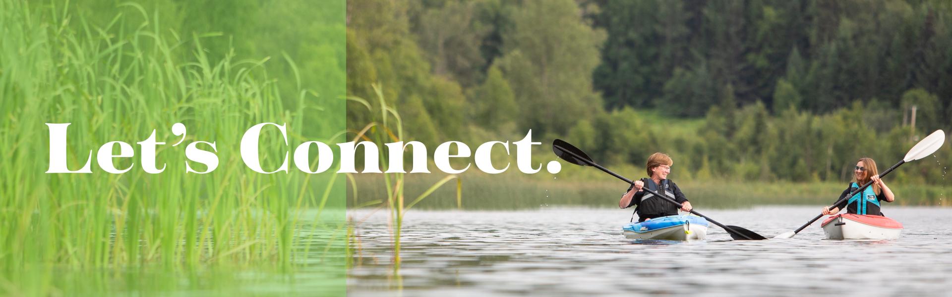 two kayakers paddling on a lake | Let's Connect