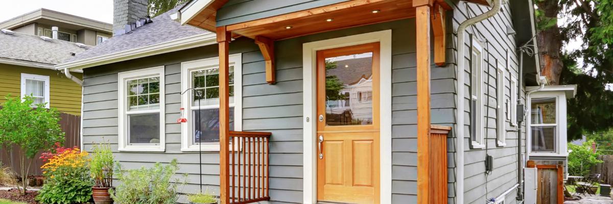 Front entrance of a carriage house with wood features
