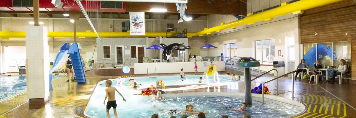 People swimming in an indoor pool