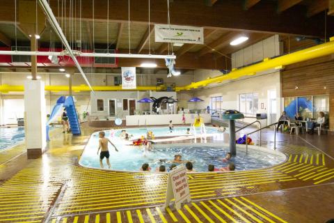 People swimming in an indoor pool